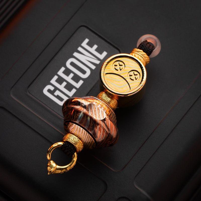 EDC Lanyard Bead – Bad Guy Smile | Titanium Zirconium Damascus Mokuti Super Conductor